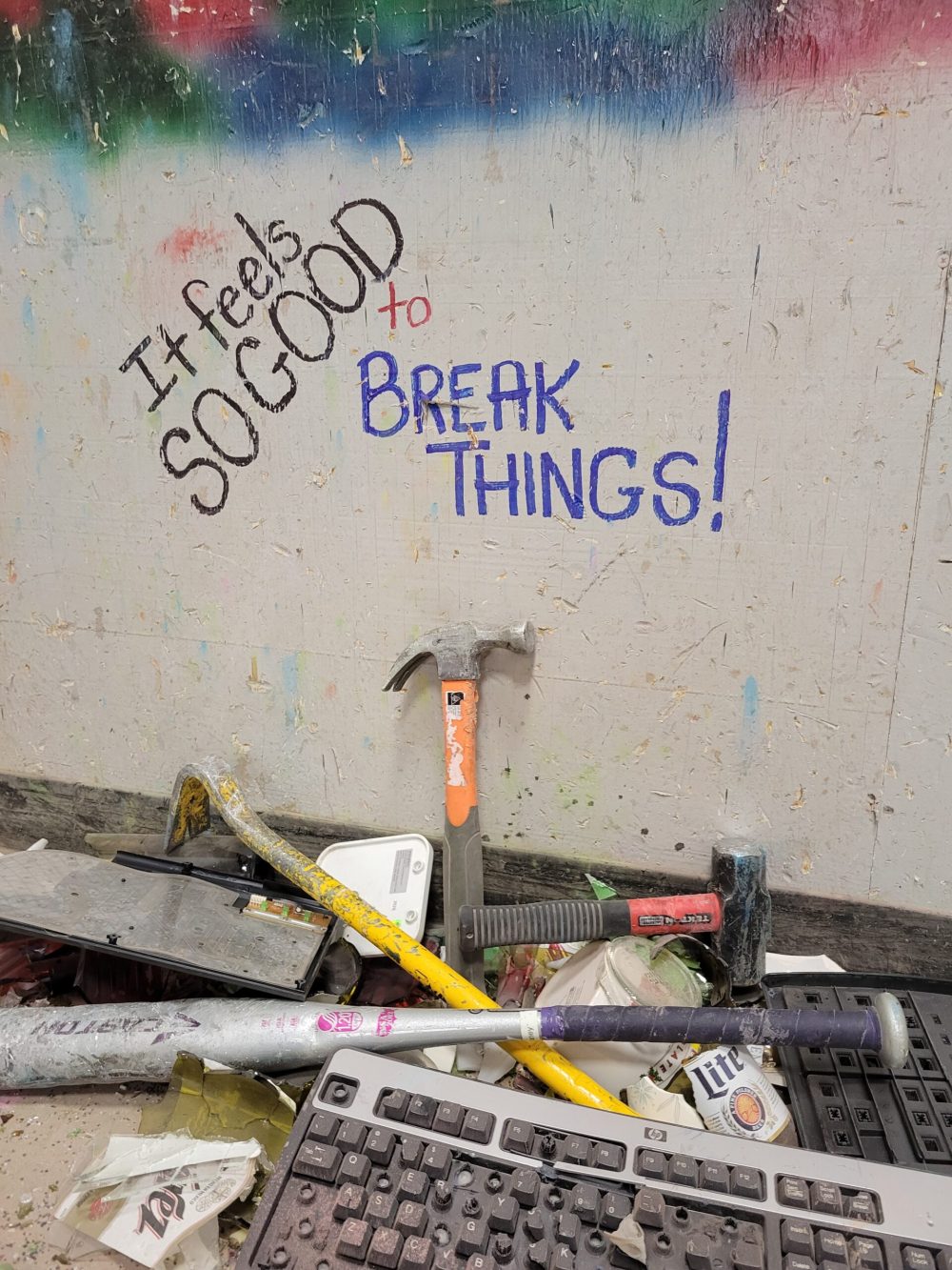 rage room with tools and broken items on the floor