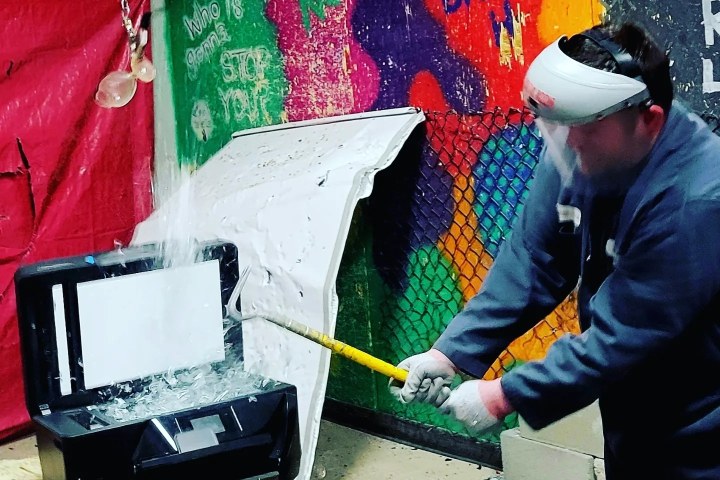 a person cutting a cake